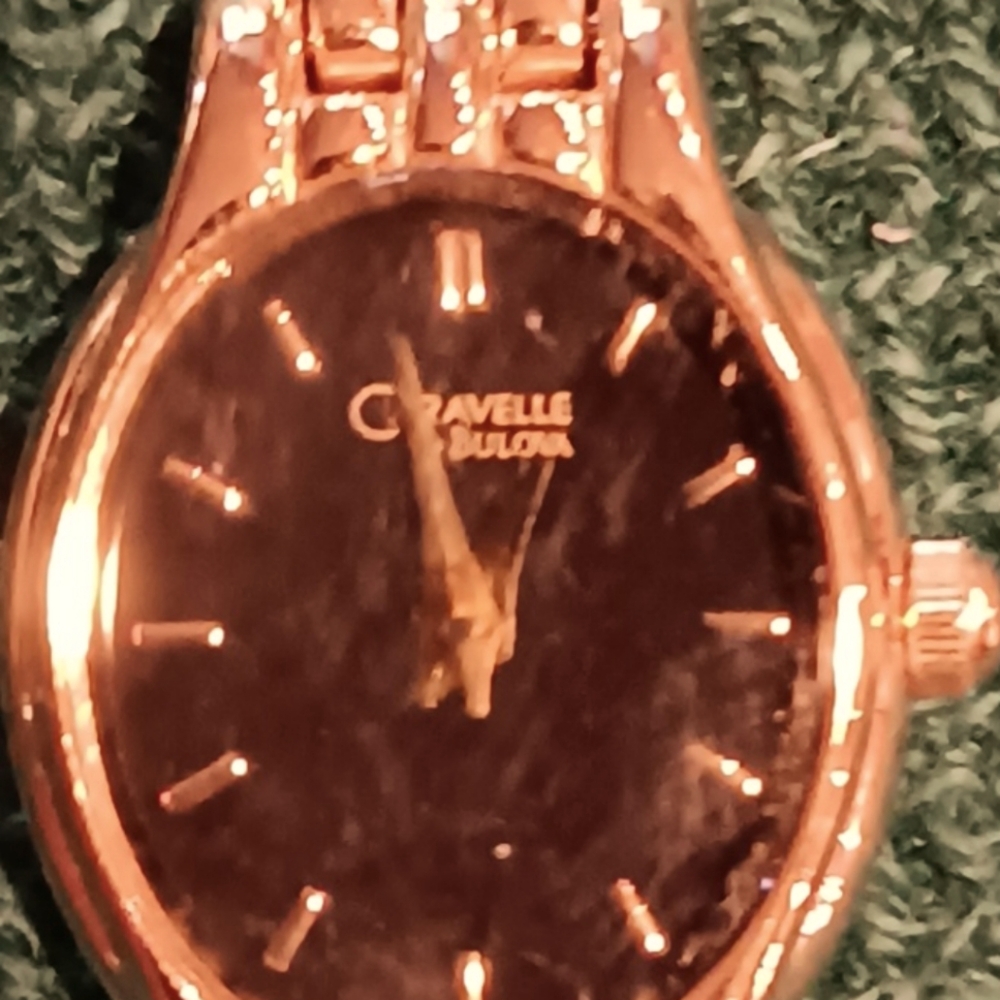 Bulova Caravelle quartz analog ladies watch with metal band